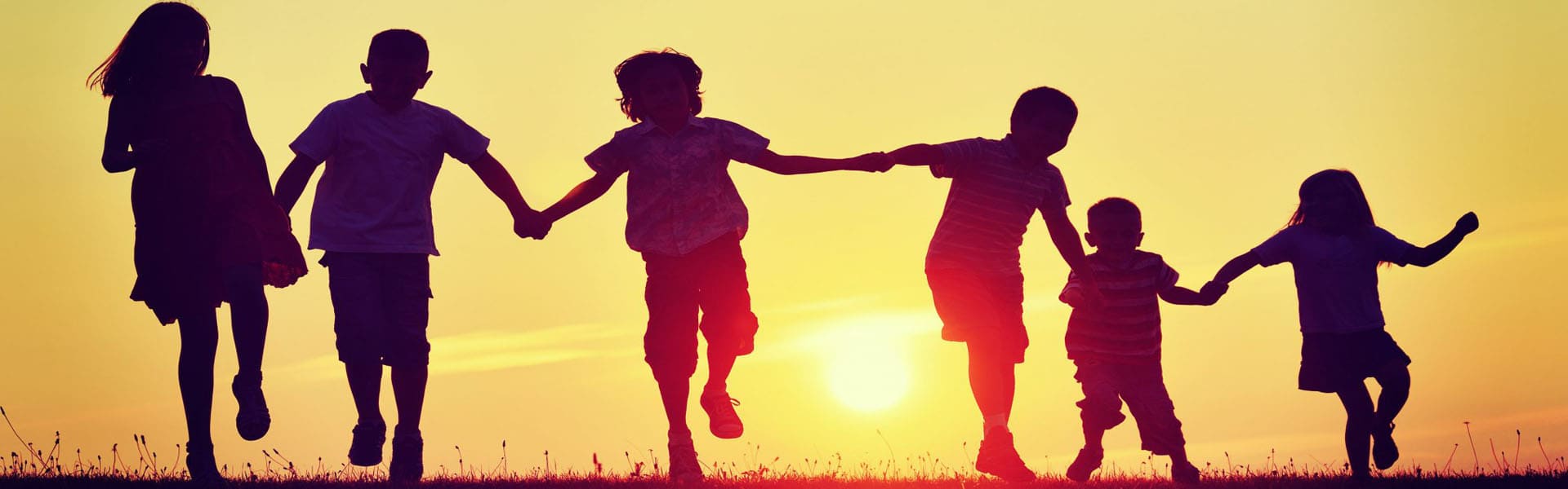 group of kids holding hands